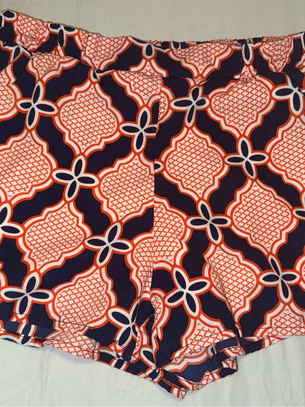 Women’s original piece orange and blue patterned shorts medium